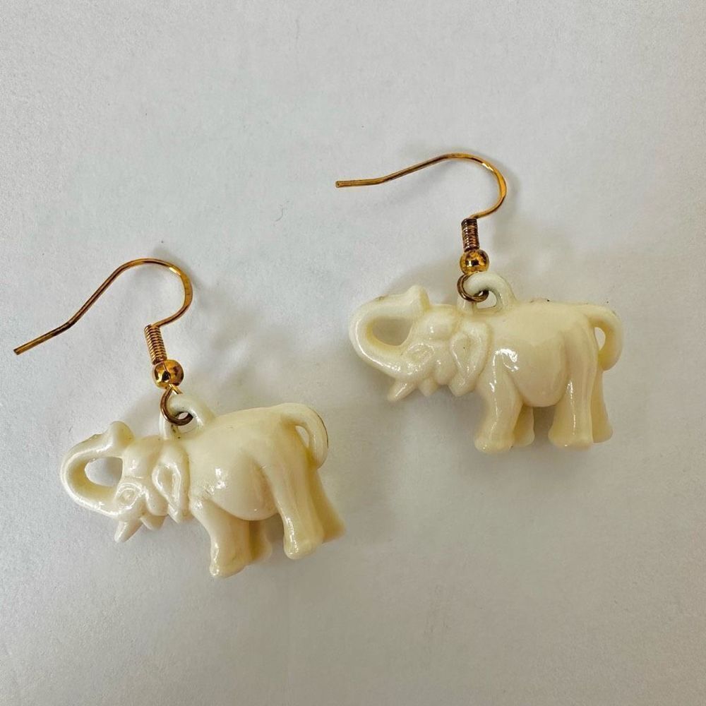 Cream elephant drop earrings